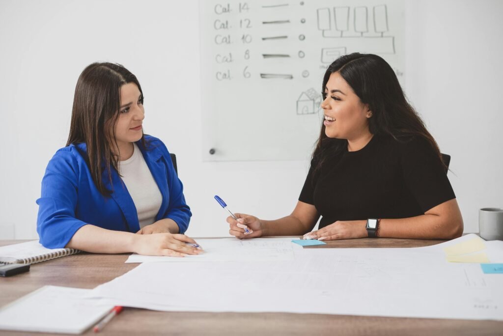 Women Colleagues Talking on Work